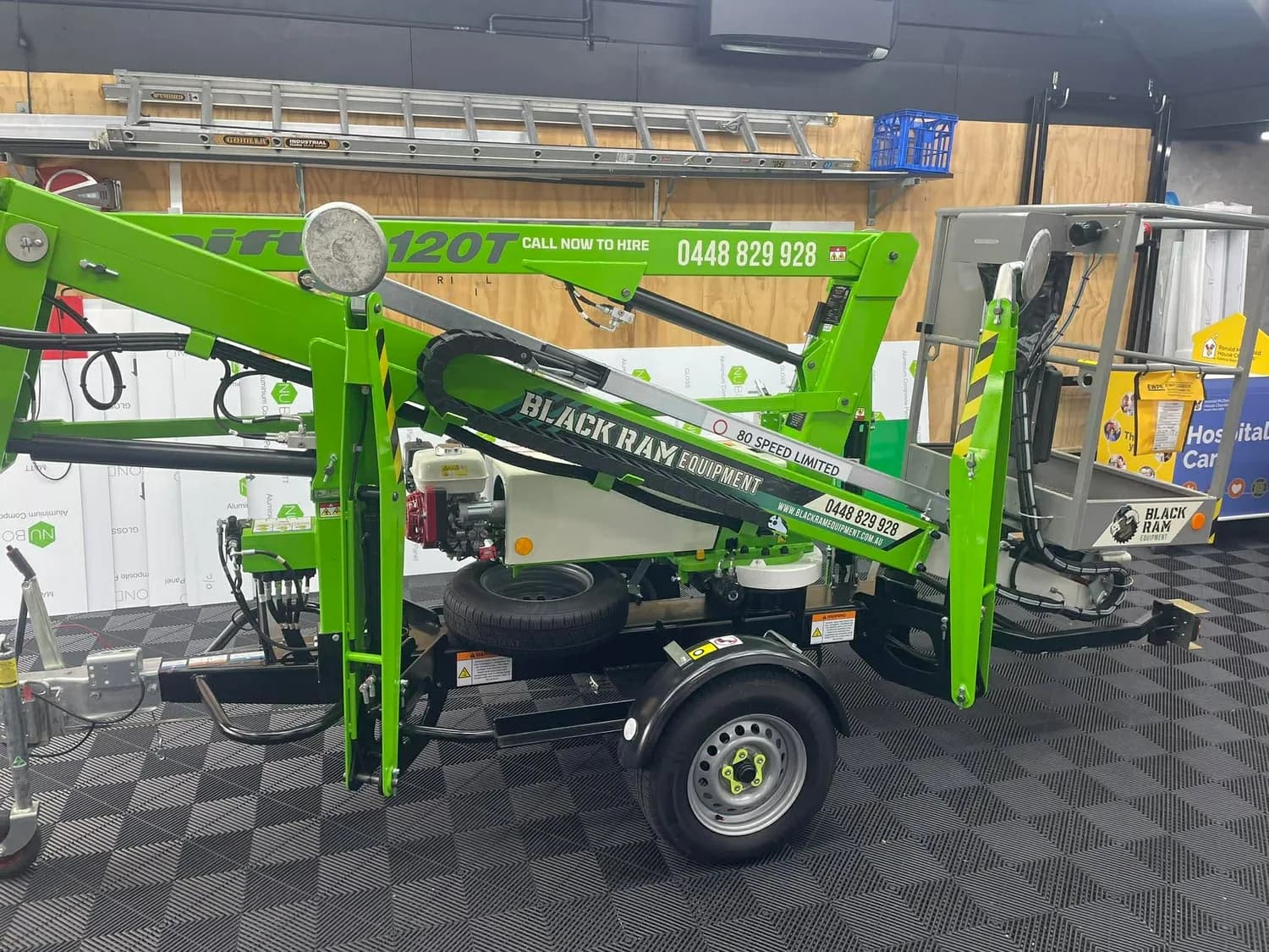 Green Black Ram Equipment cherry picker / boom lift wrap