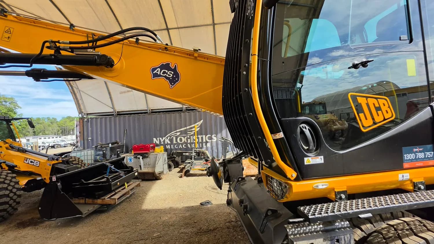 ACE / JCB excavator with branded arm decals