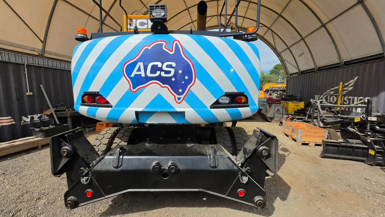Blue and white striped ACS wrap on rear of machine