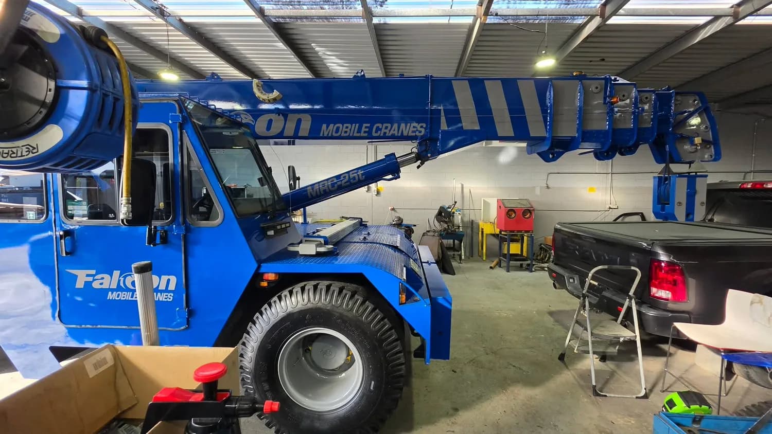 Blue Falcon Mobile Cranes wrap, side view in workshop