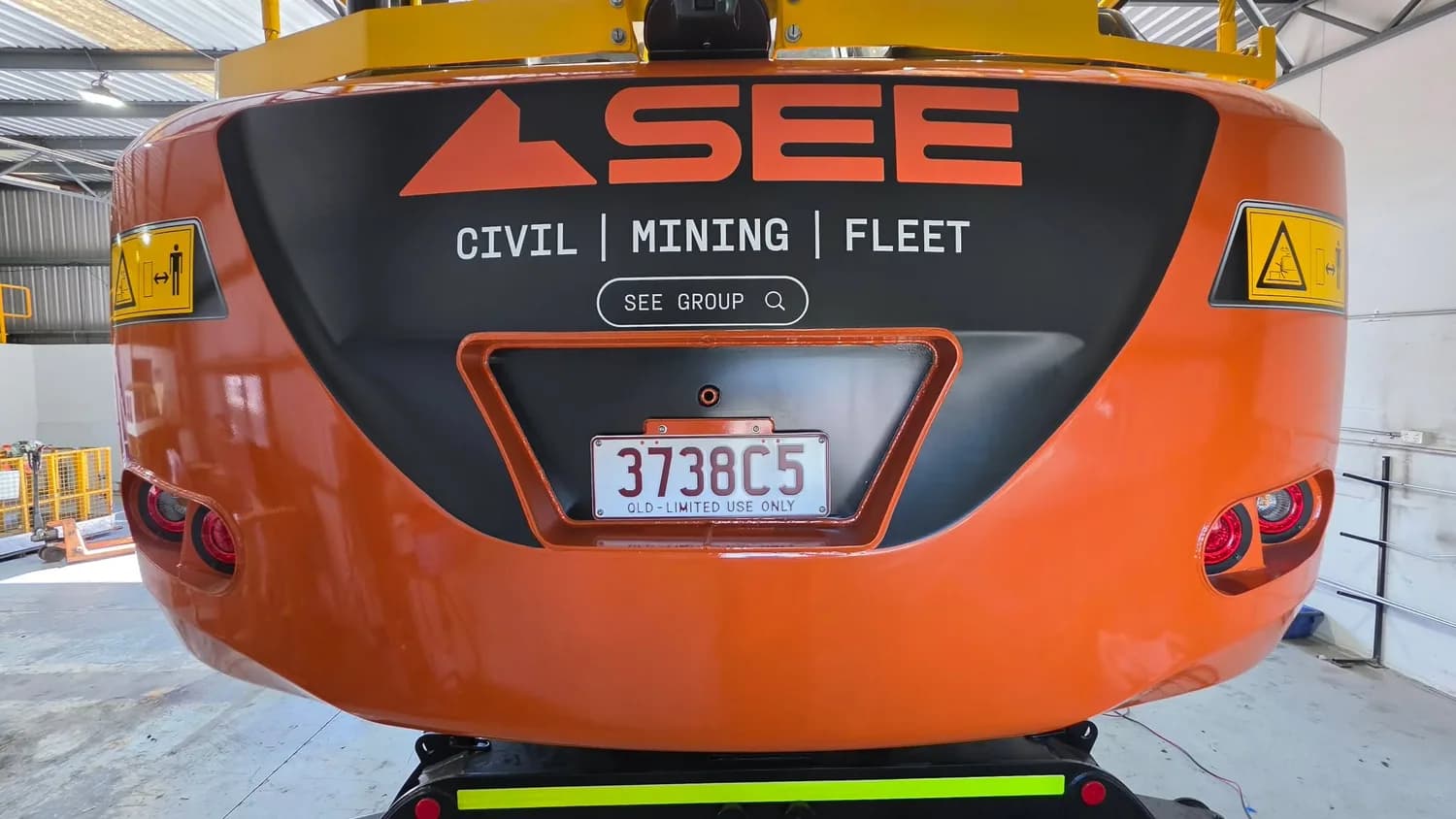 SEE Civil Mining Fleet orange crane counterweight branding
