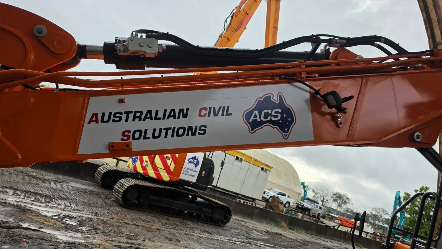 Australian Civil Solutions long-reach excavator branding