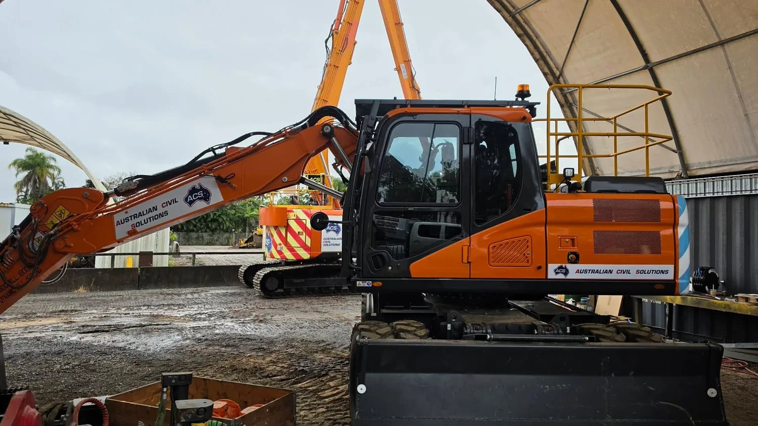 Australian Civil Solutions orange excavator decals