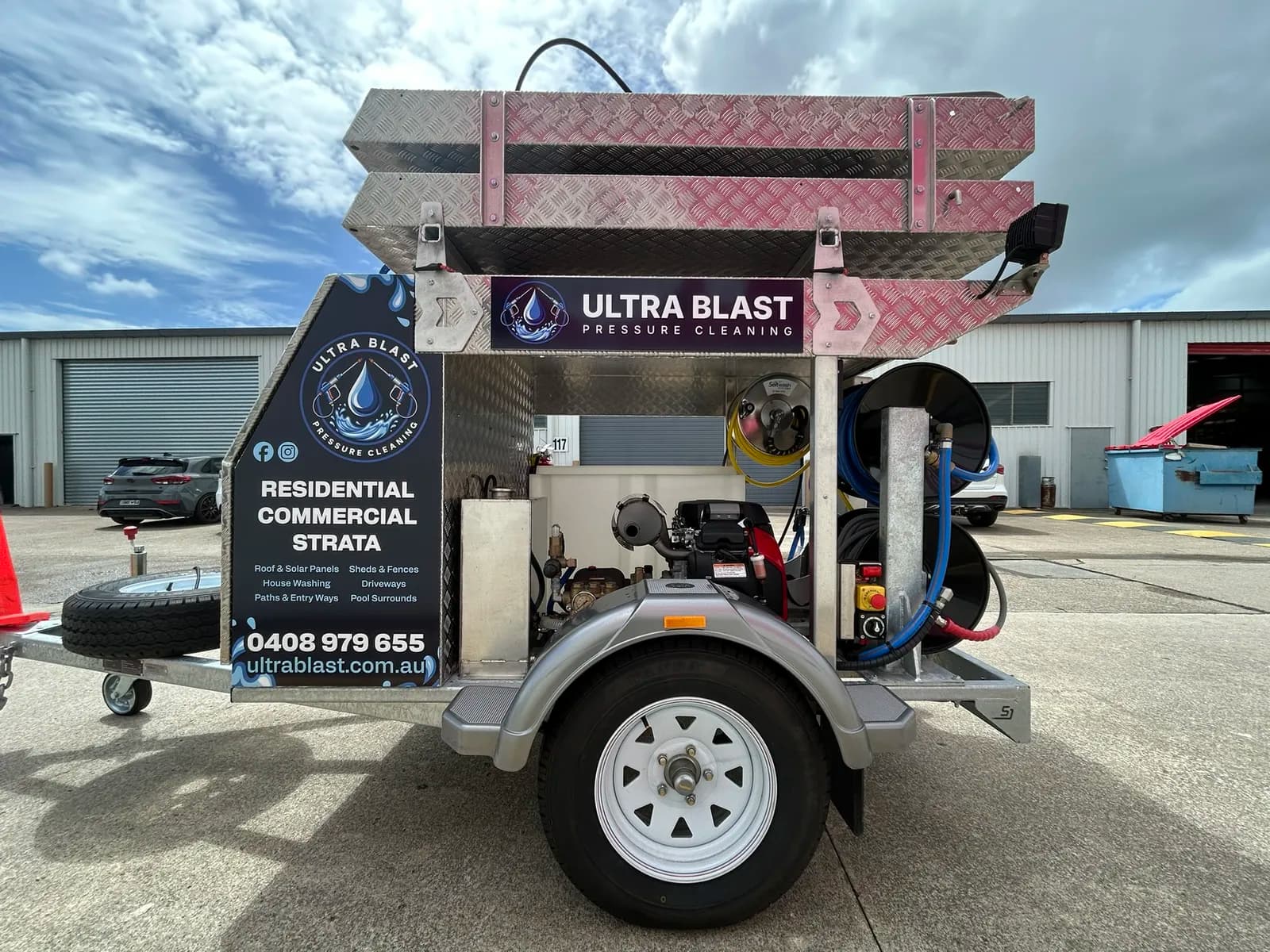 Ultra Blast trailer side close-up, hose reels