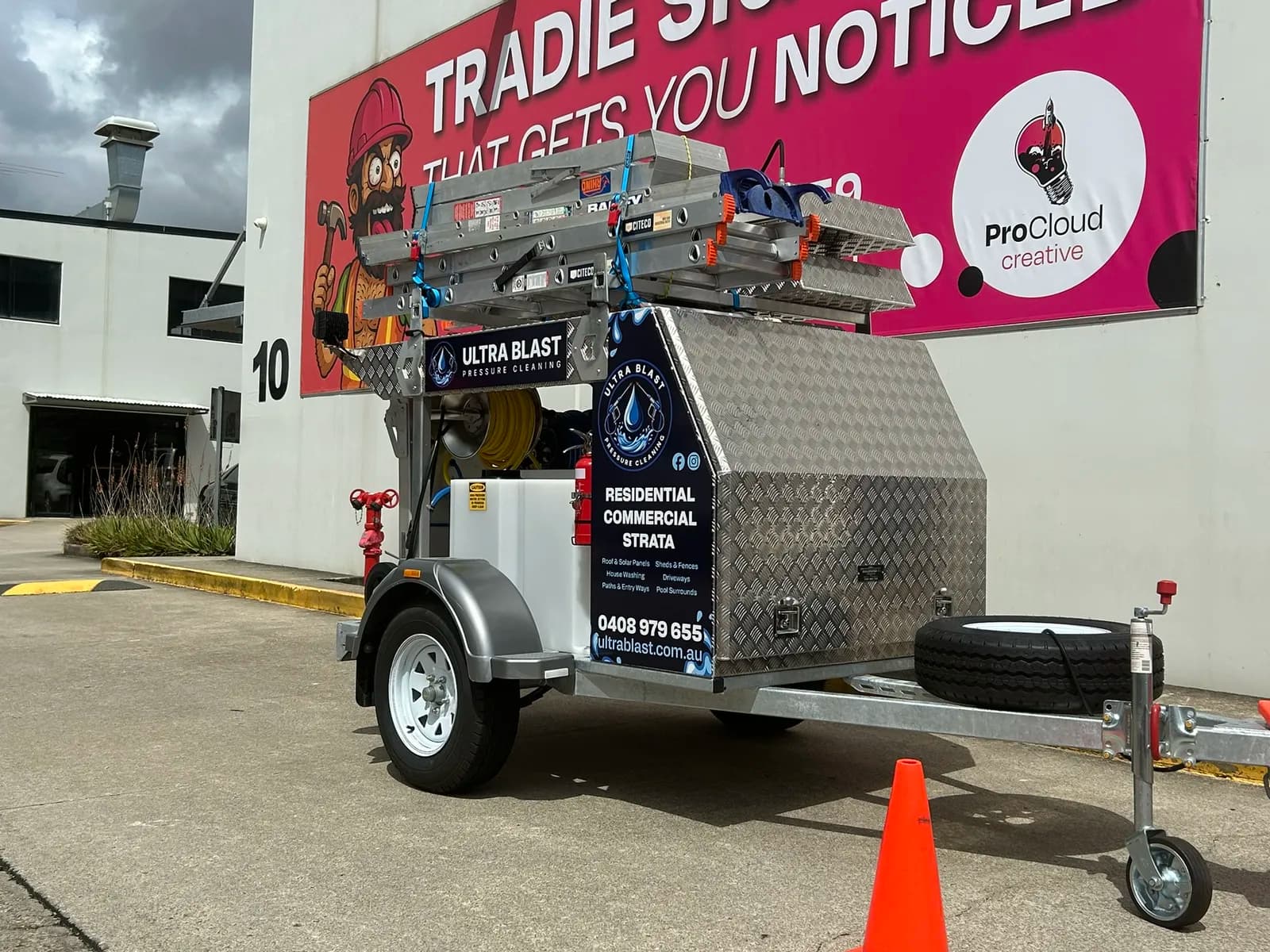 Ultra Blast trailer signage detail, ProCloud banner behind