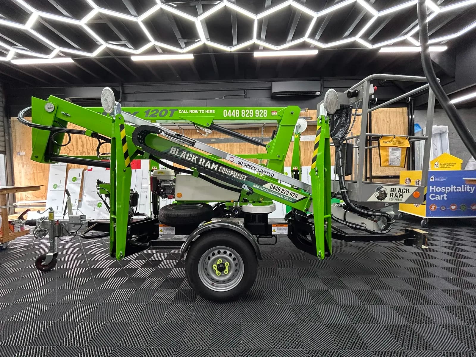 Black Ram Equipment boom lift decals, workshop side view