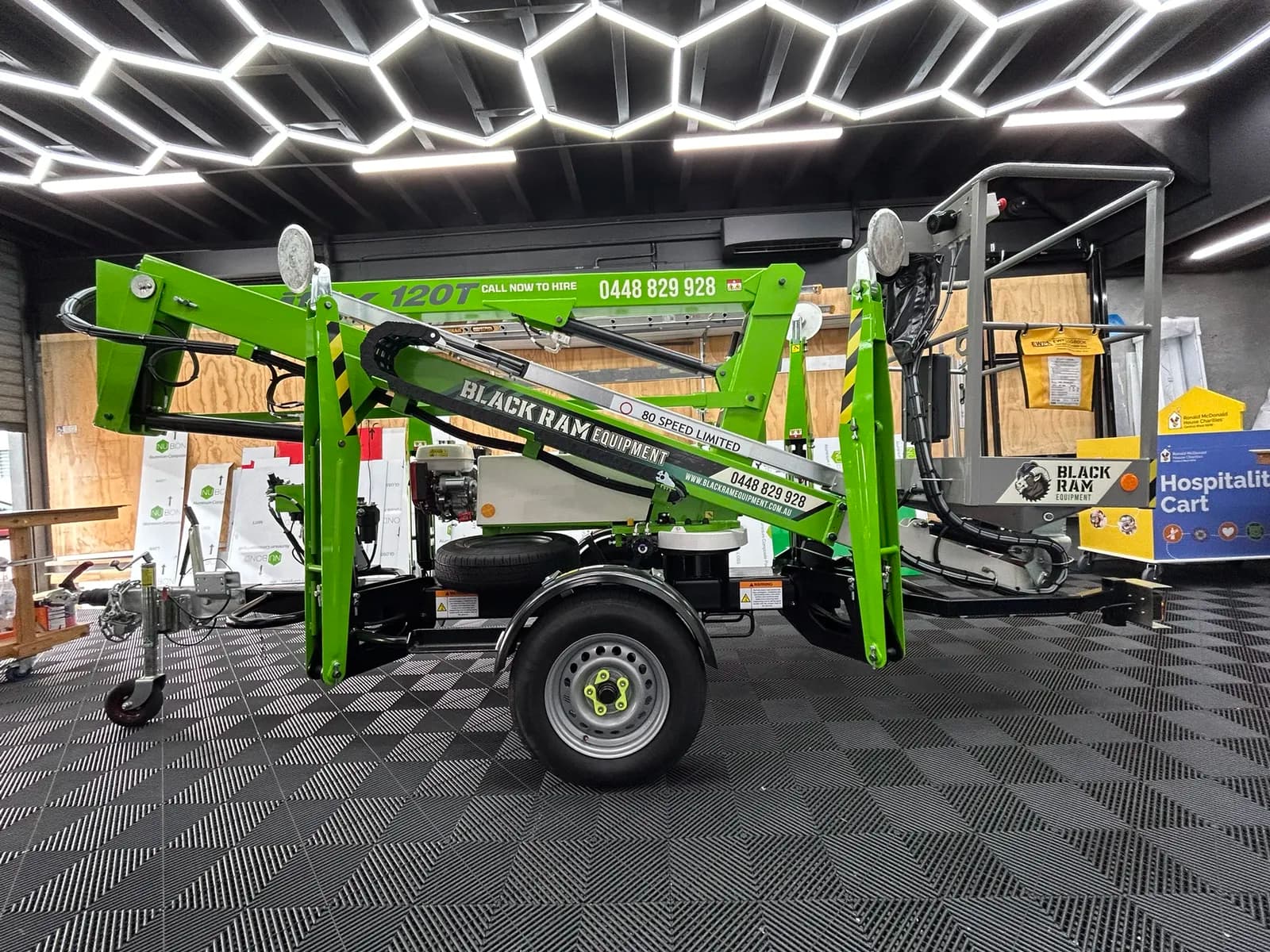 Black Ram Equipment towable boom lift, workshop
