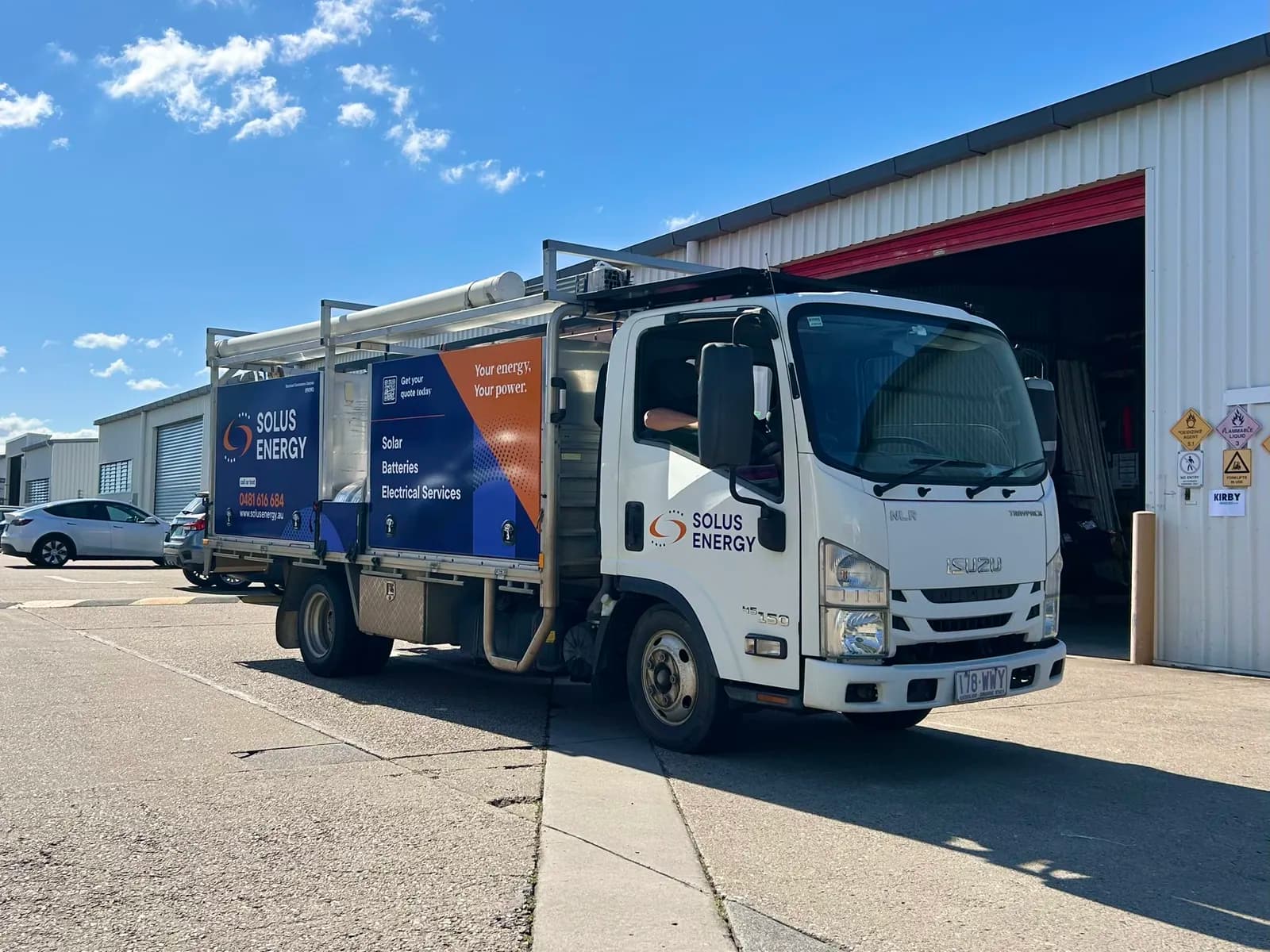 Solus Energy truck front three-quarter outside workshop