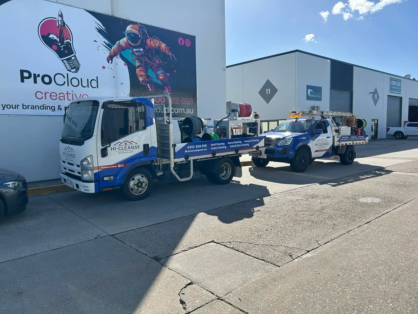 Two Hi-Cleanse work vehicles outside ProCloud