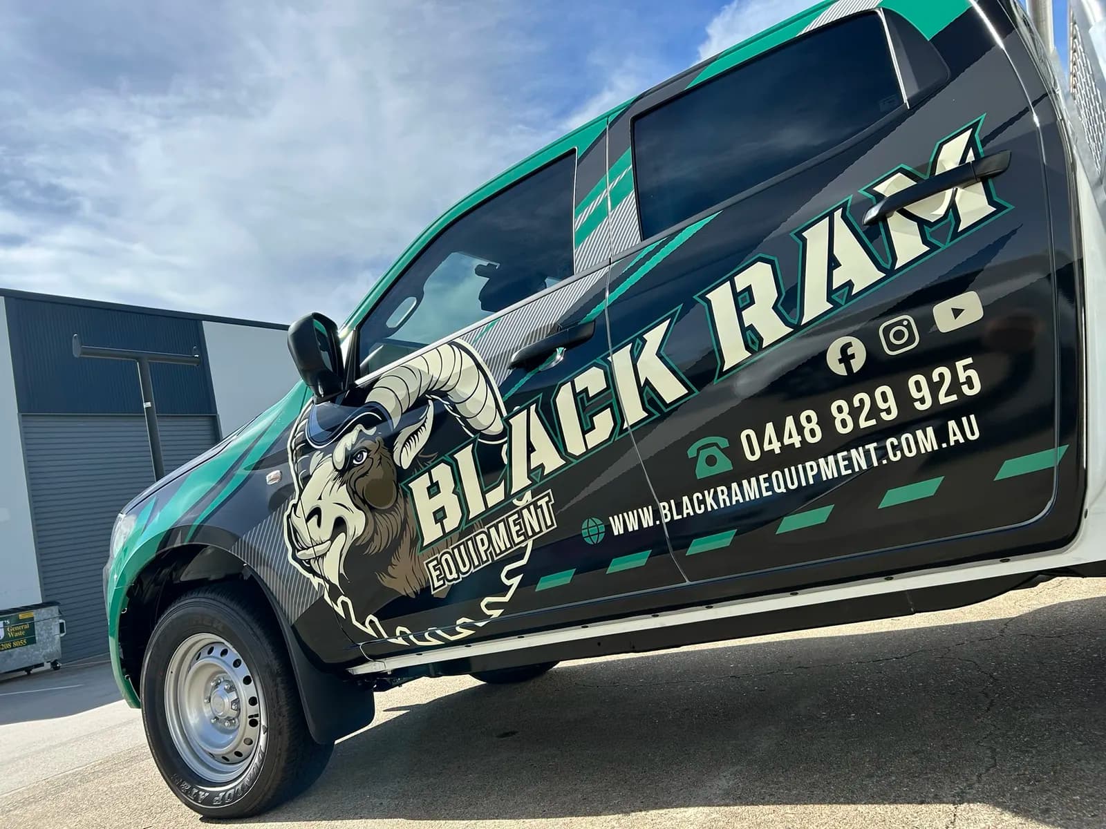 Black Ram side wrap detail with contact info