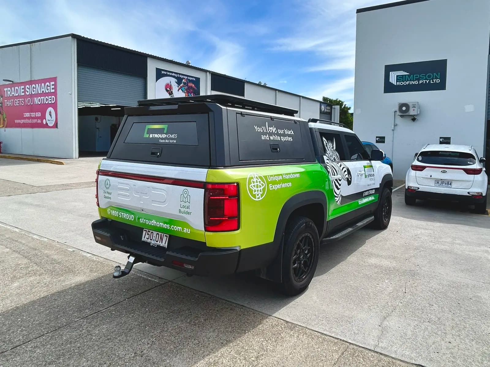 Stroud Homes BYD rear three-quarter, tradie banner