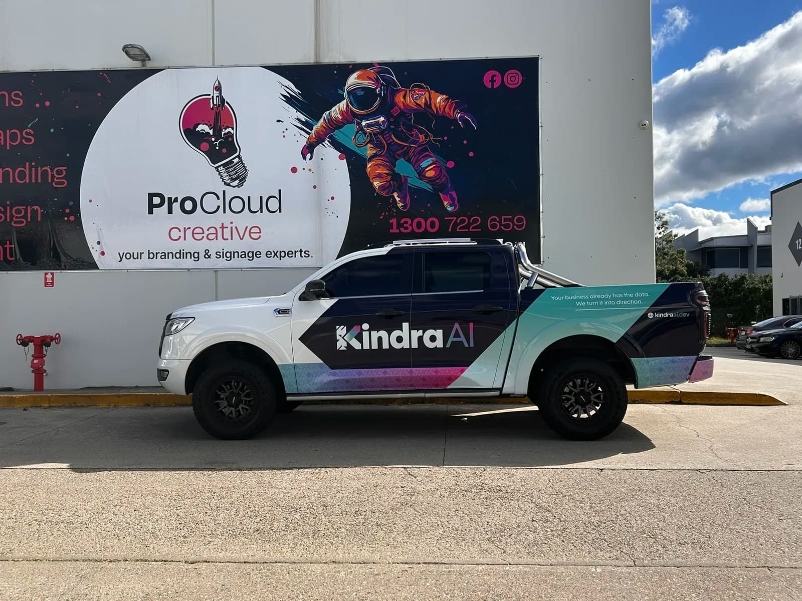 Kindra AI ute under ProCloud Creative sign