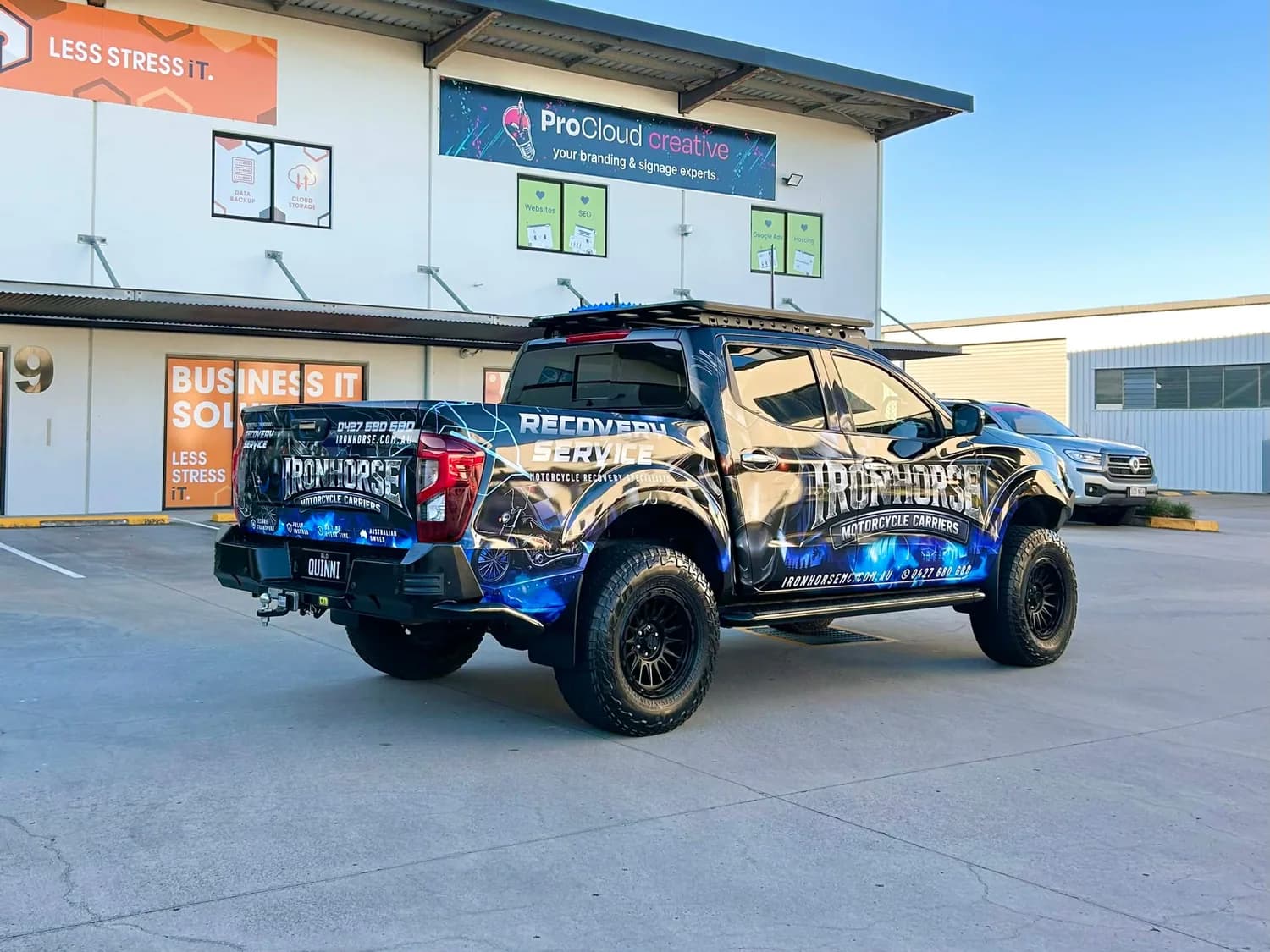Ironhorse wrapped ute front outside ProCloud building