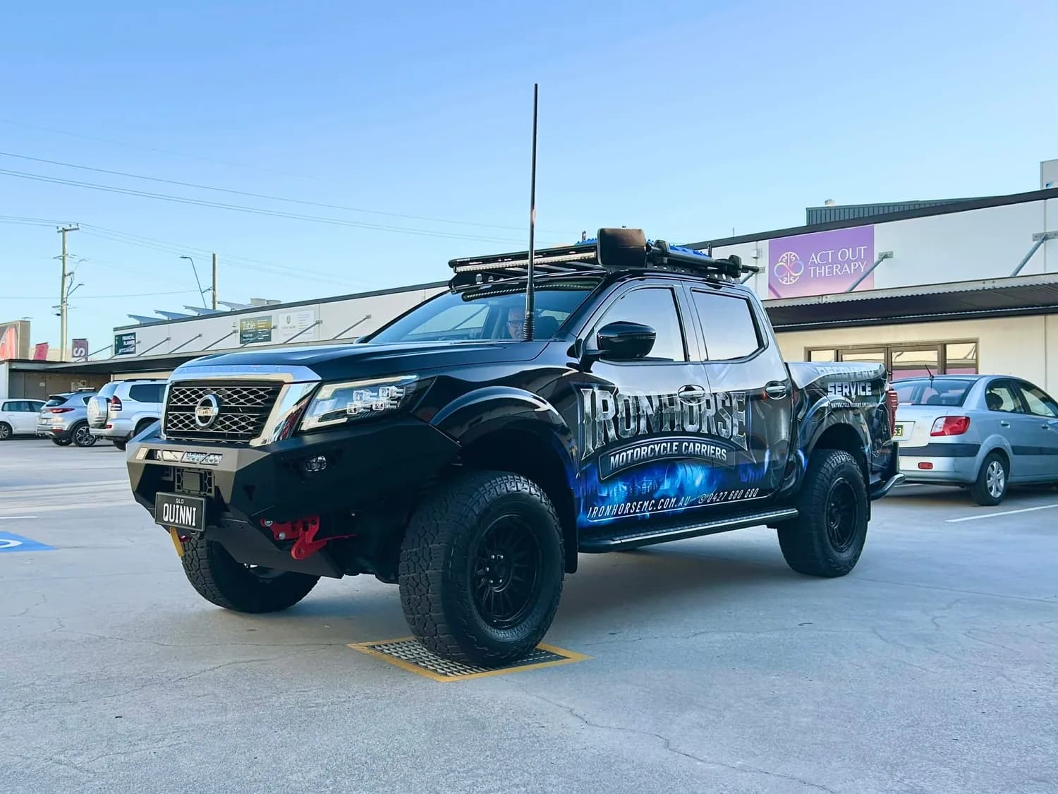 Ironhorse dark wrapped ute rear three-quarter view