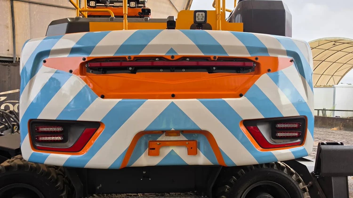 Rear of vehicle with orange/white chevron safety wrap