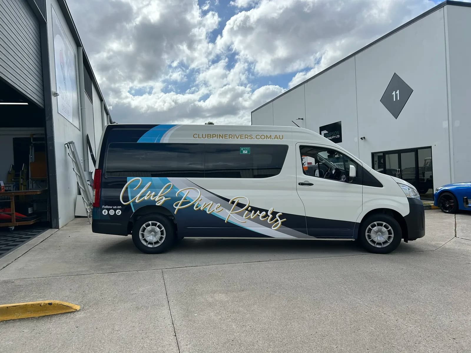 Club Pine Rivers van side profile, gold script