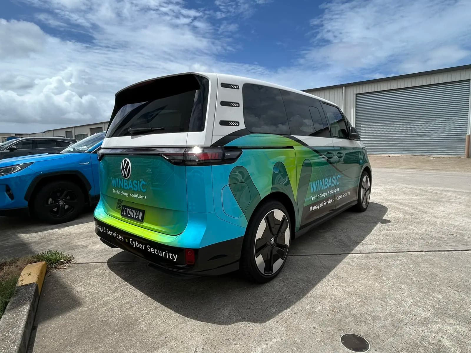 Winbasic ID Buzz rear three-quarter, dramatic sky