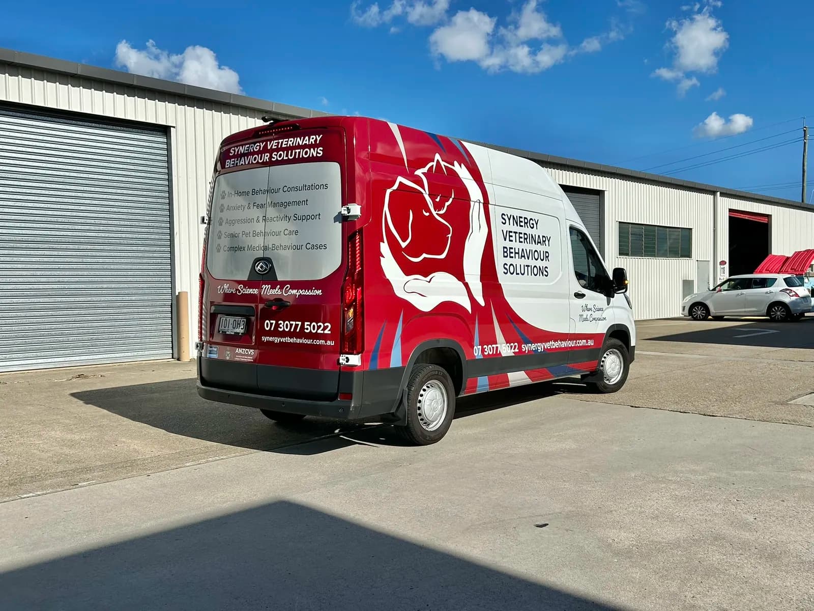 Synergy Veterinary van, rear side view with dog logo