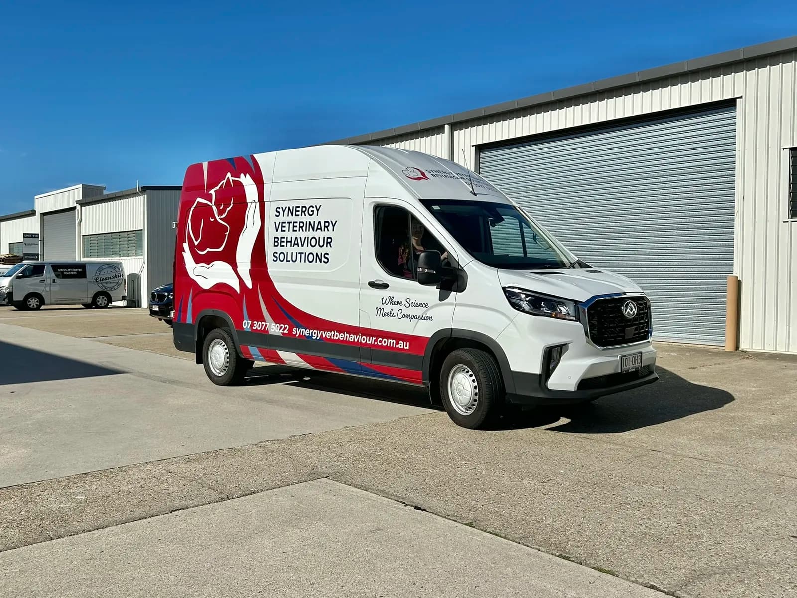 Synergy Veterinary van front three-quarter, driver visible