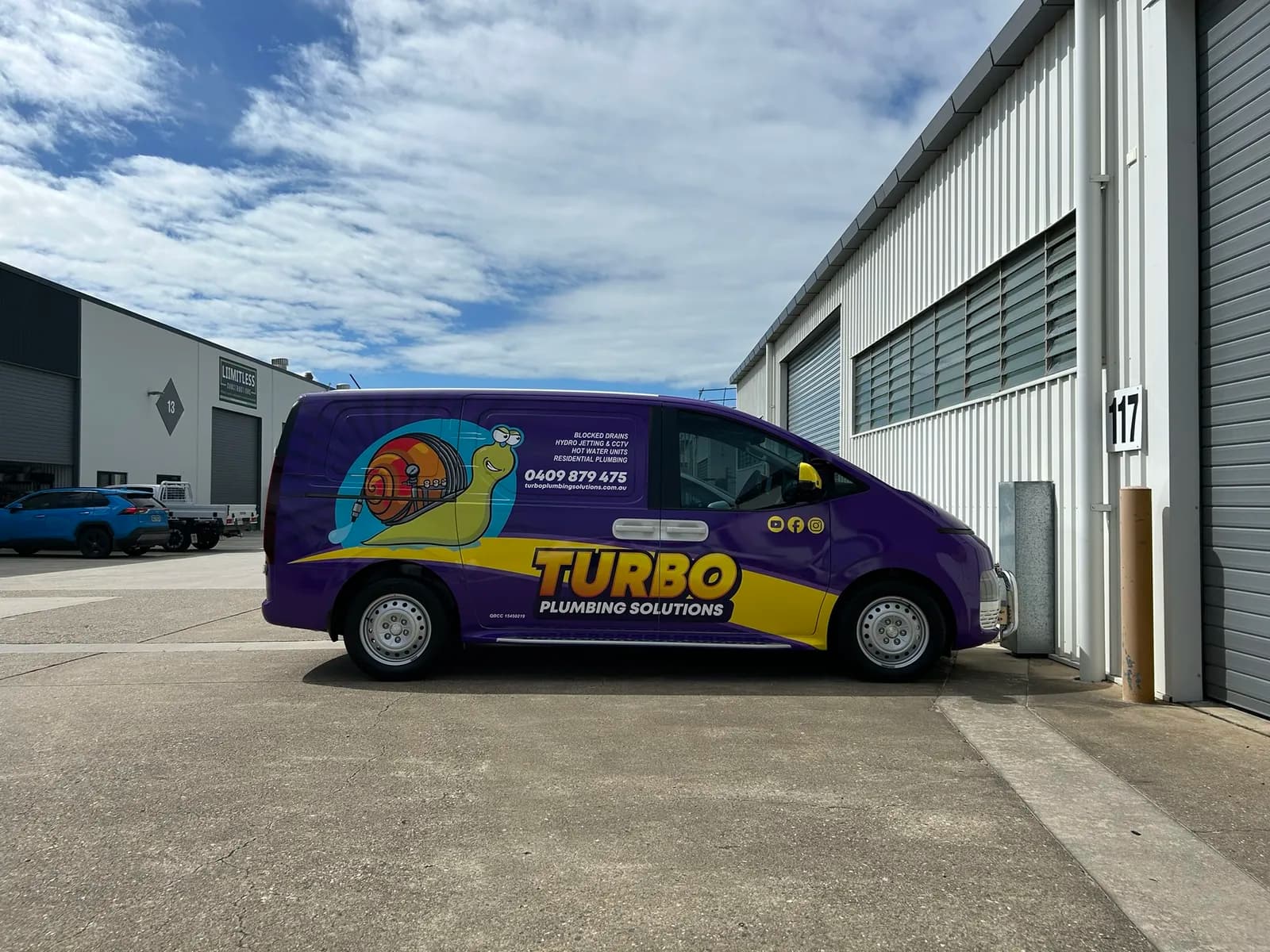 Turbo Plumbing purple van, full side profile