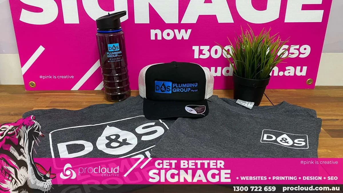 Branded apparel, drink bottle and cap flat-lay