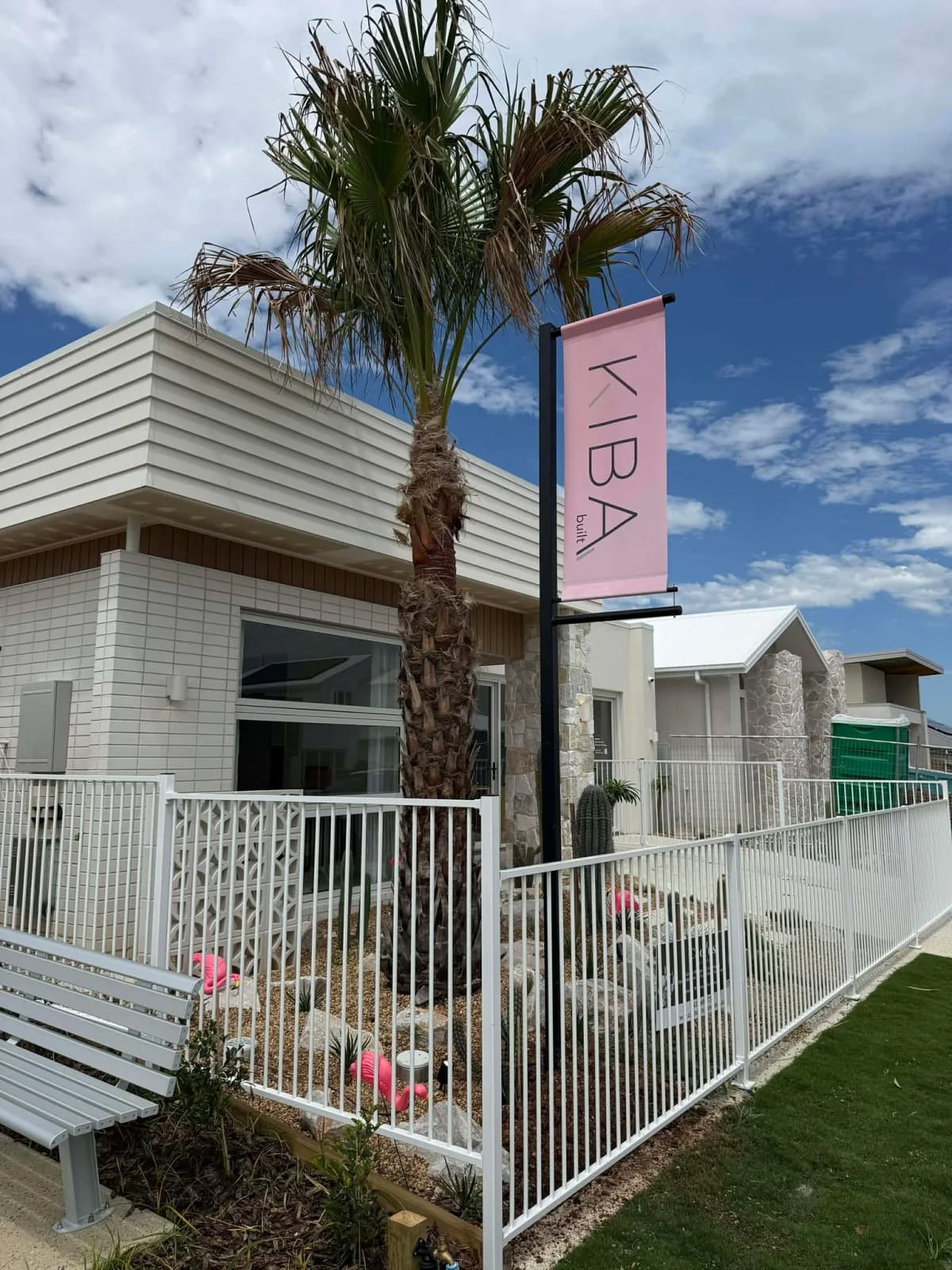 Kiba Built banner flag outside a new residence