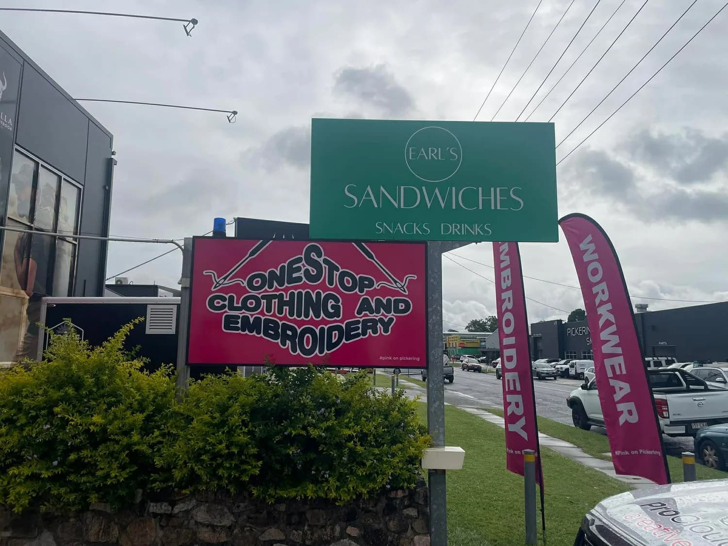 One Stop Clothing pole signs with Workwear feather flags