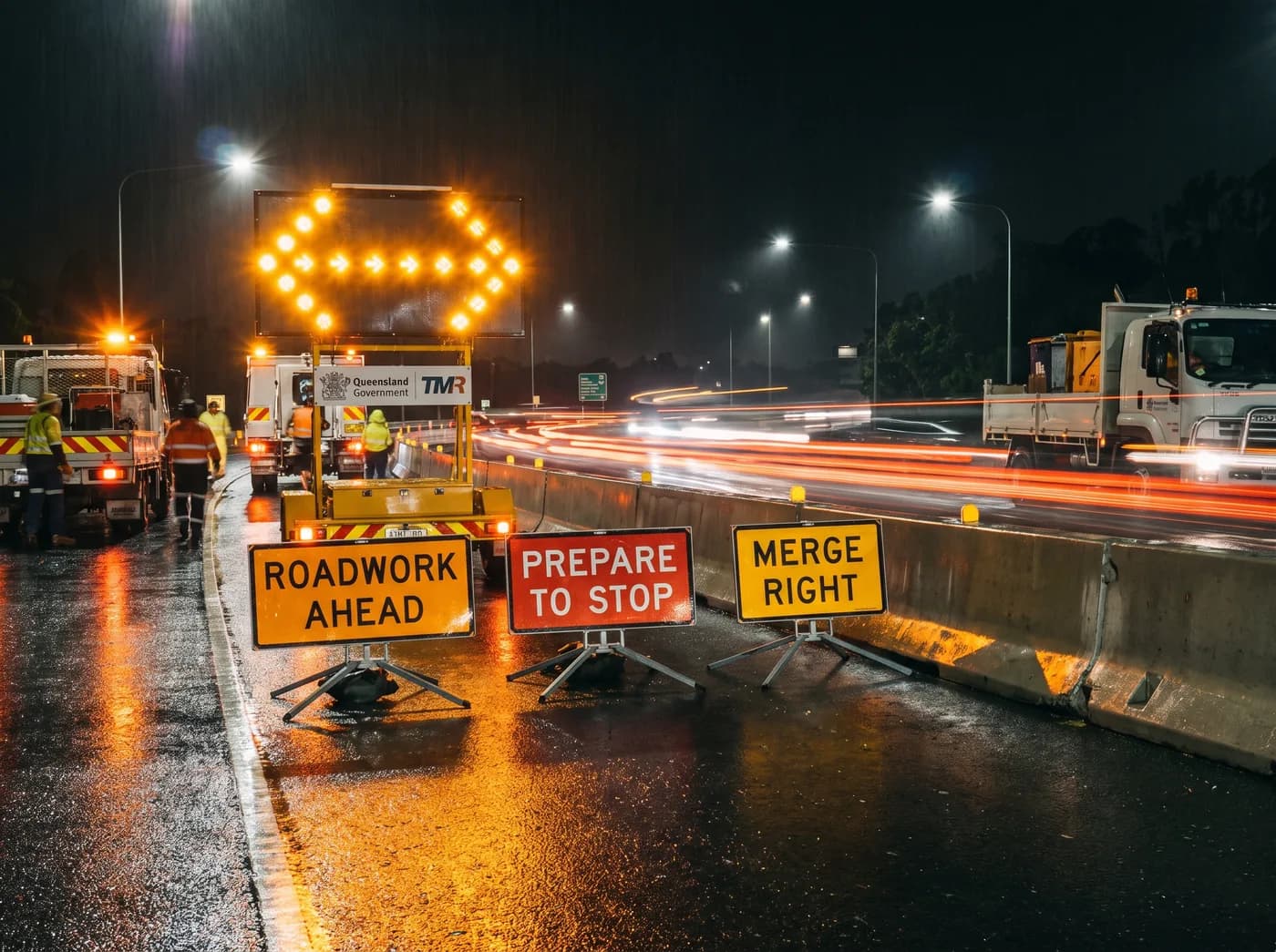 Night roadworks traffic signage and arrow board