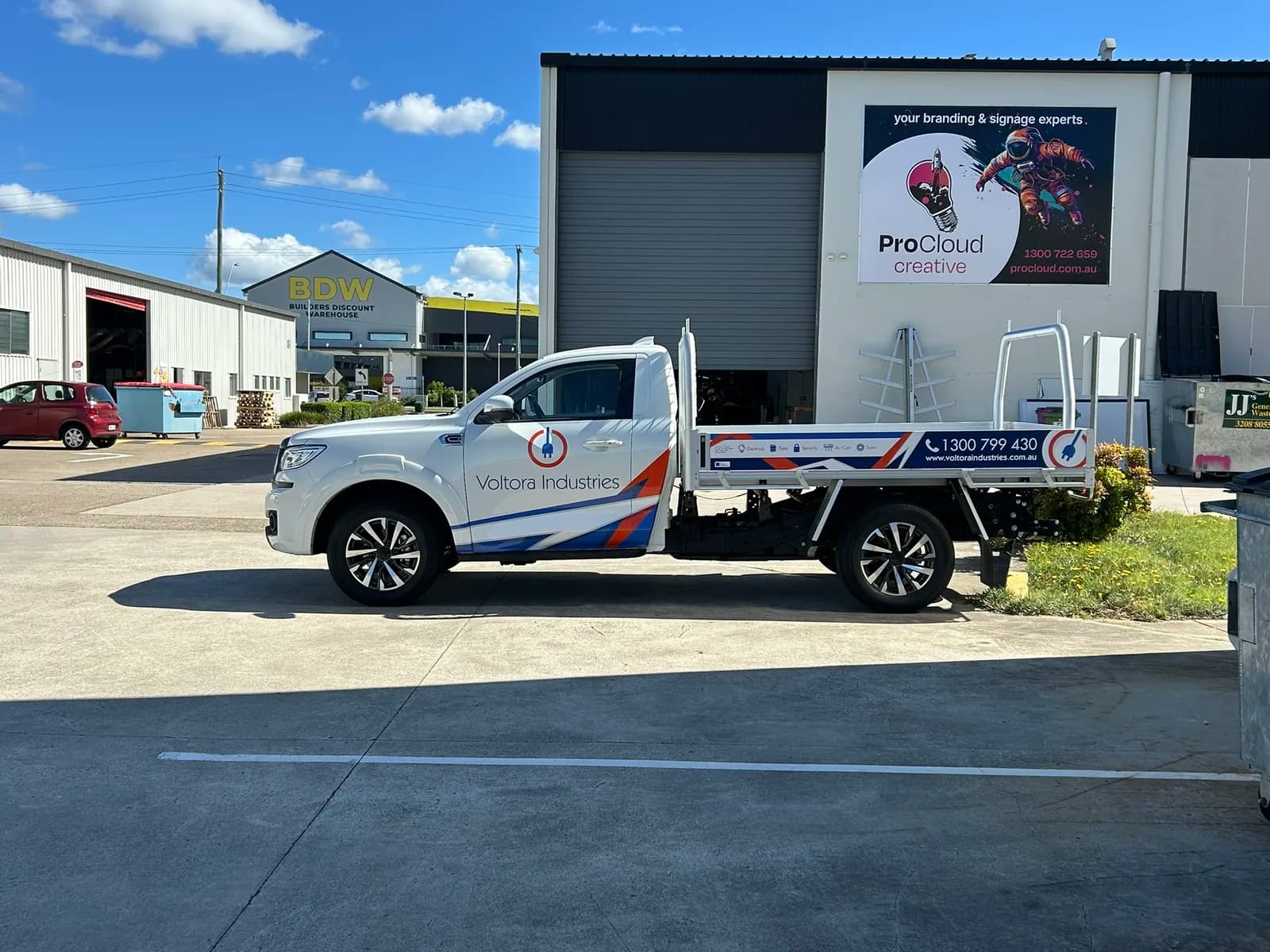 Voltora Industries ute side profile, ProCloud banner behind