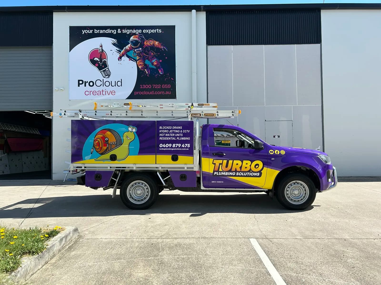 Turbo Plumbing purple ute, snail mascot wrap