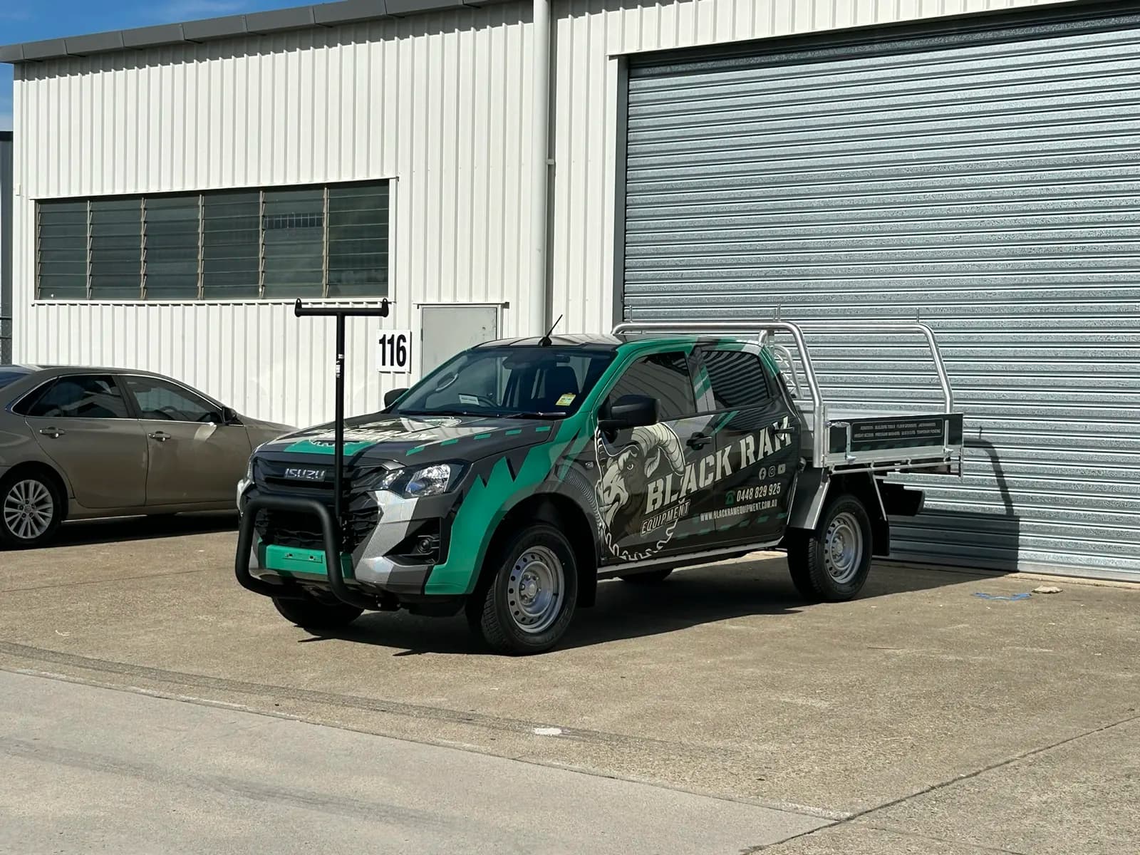 Black Ram Equipment Isuzu D-Max wrap, front three-quarter
