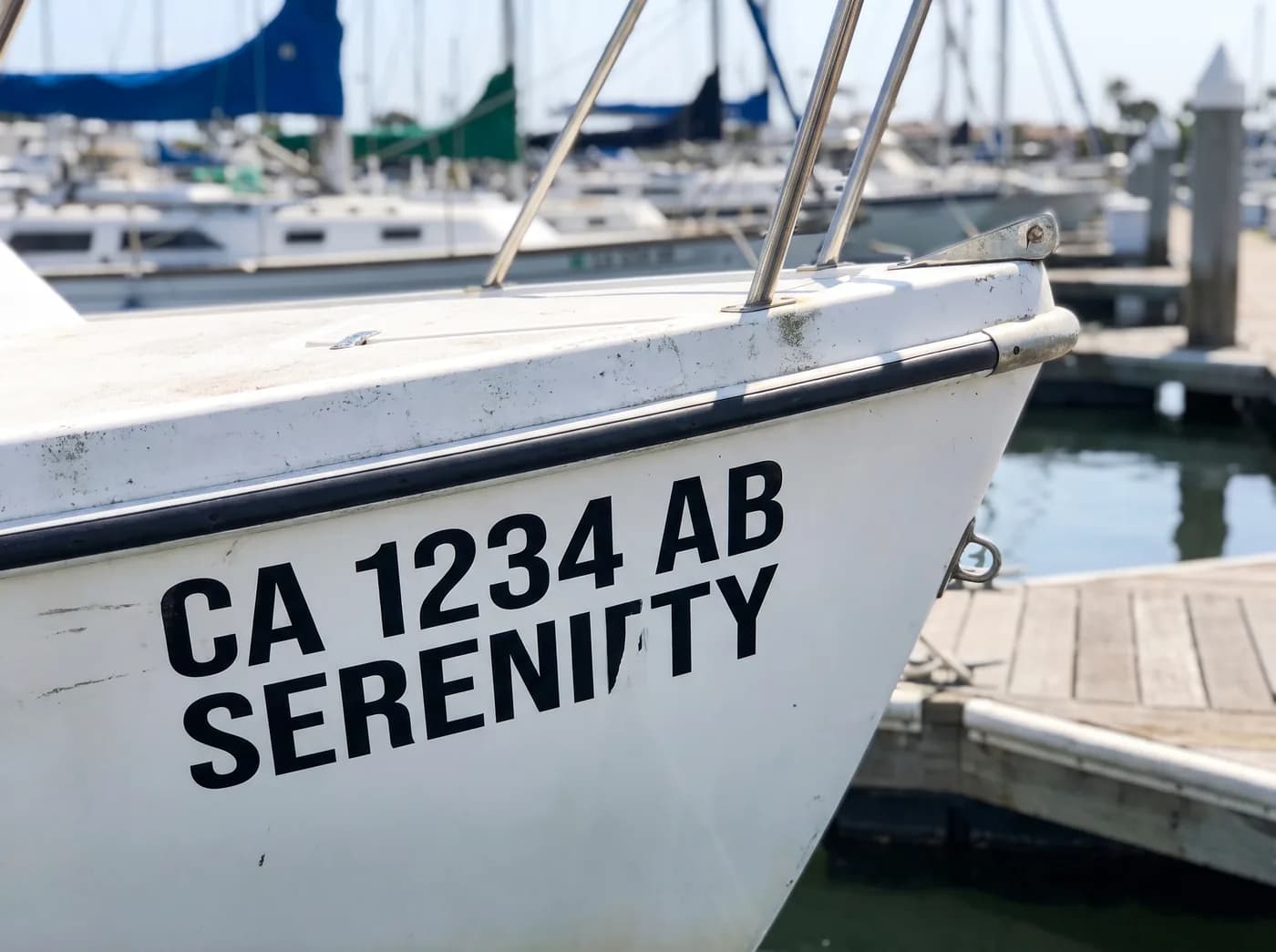 Boat registration numbers on a hull