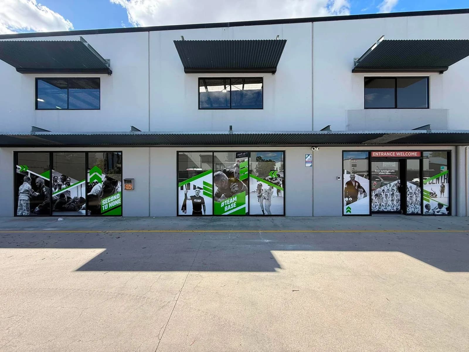 Base full-height window graphics across a warehouse fit-out