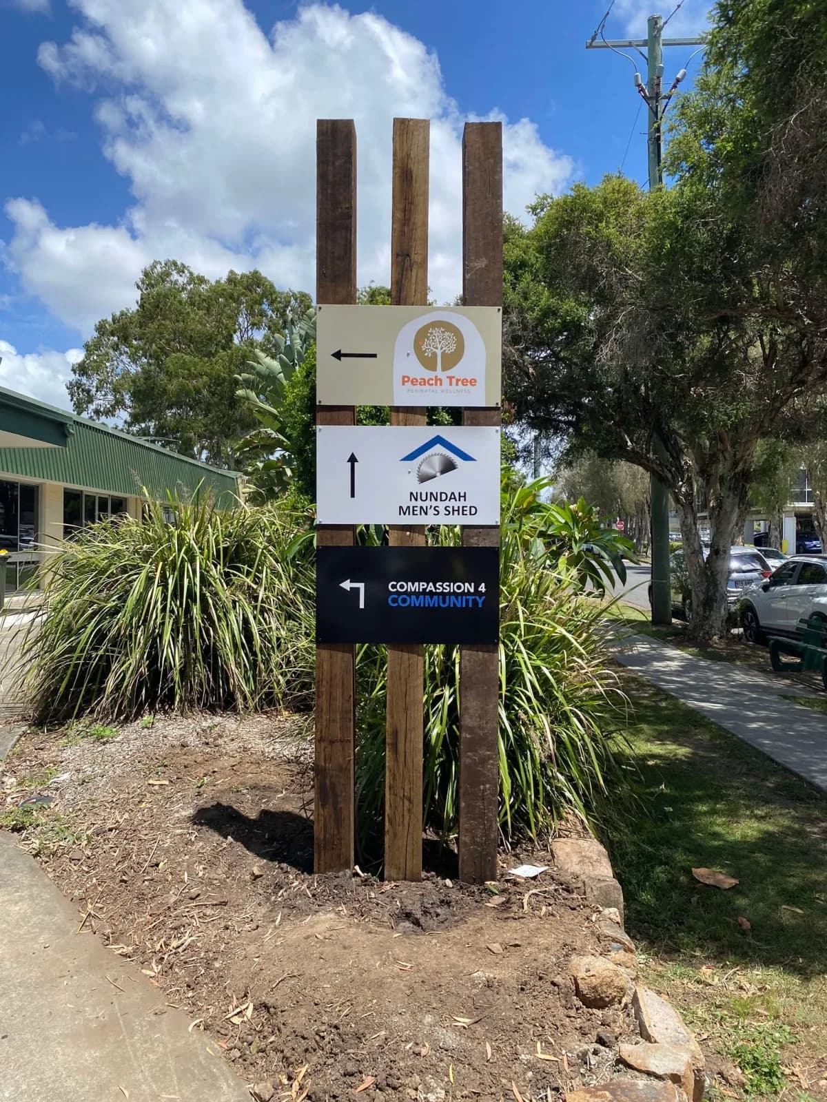Peach Tree timber-post directory sign with tenant panels