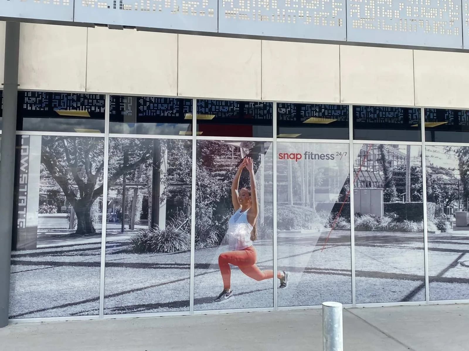 Snap Fitness printed window graphics across a shopfront
