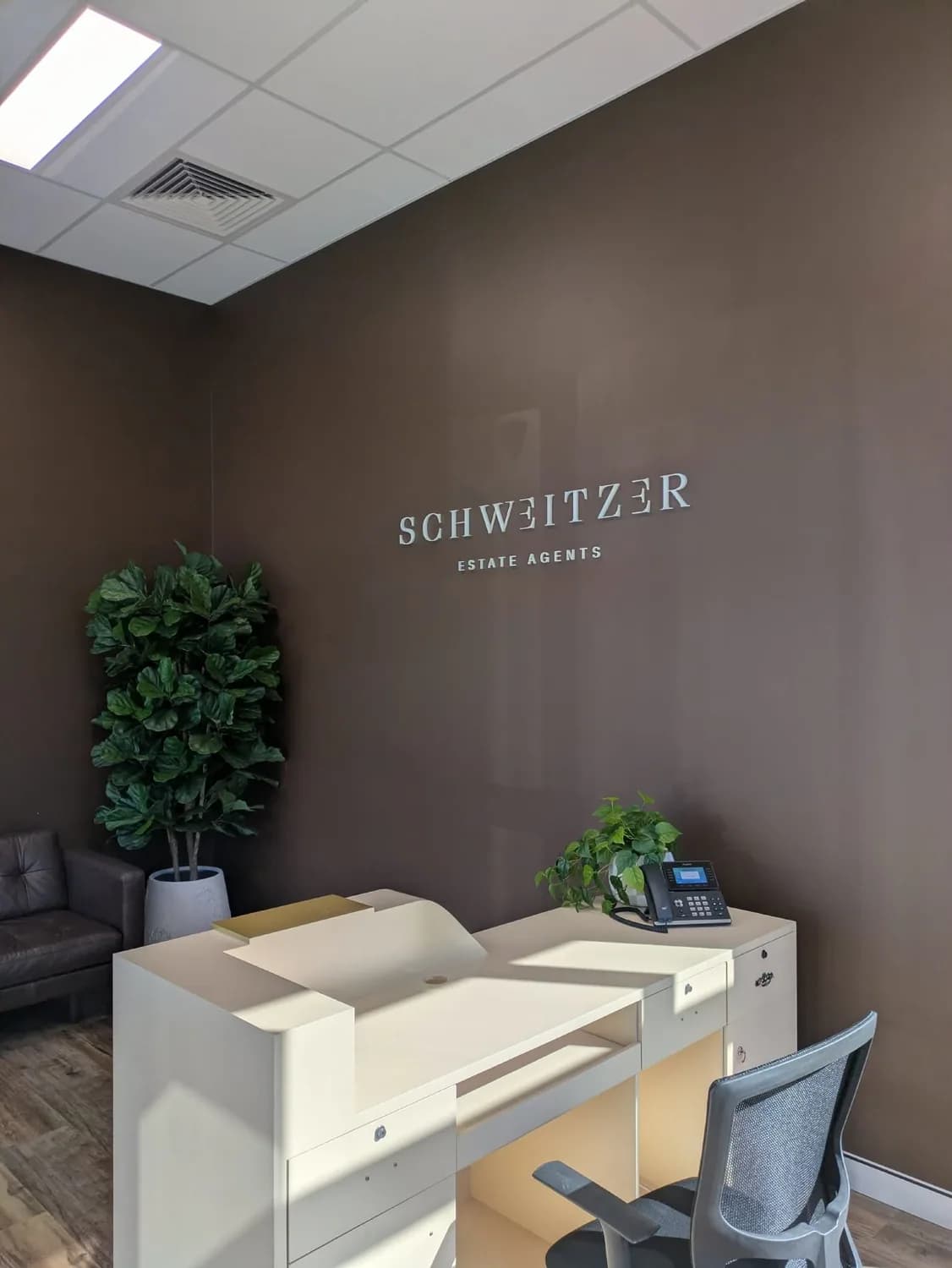 Schweitzer interior reception signage with desk