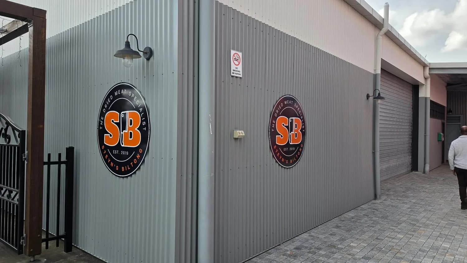 Twin SB logos on grey exterior wall panels