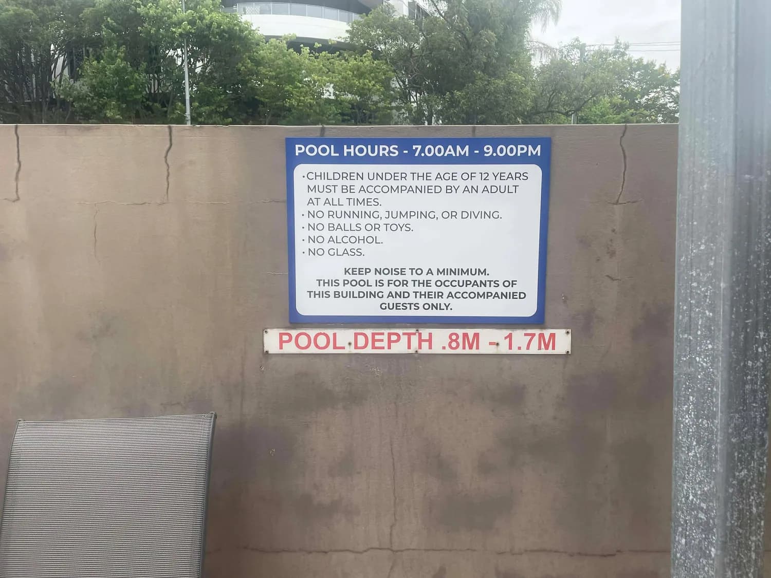 Statutory pool rules sign, pool hours and depth notice