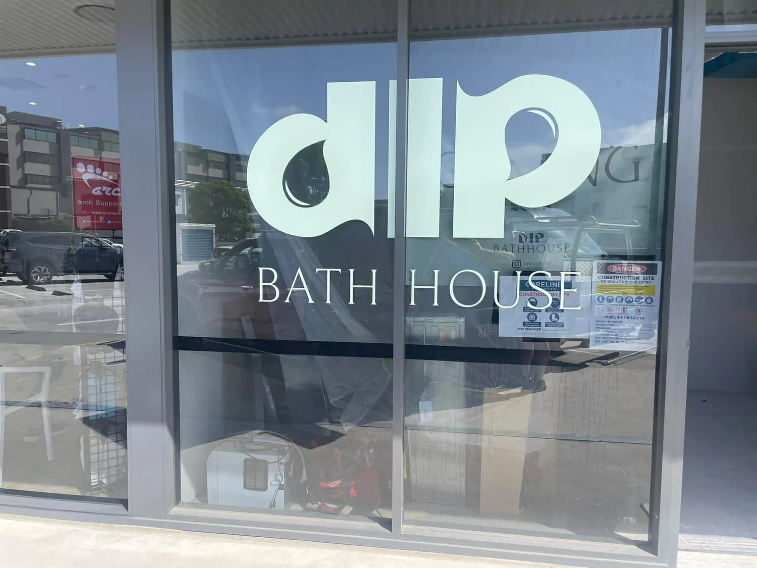 dip Bath House frosted/printed window graphics on glass storefront